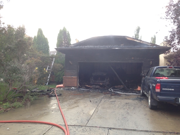 Crews attend to a house fire in east Regina on Sunday evening.